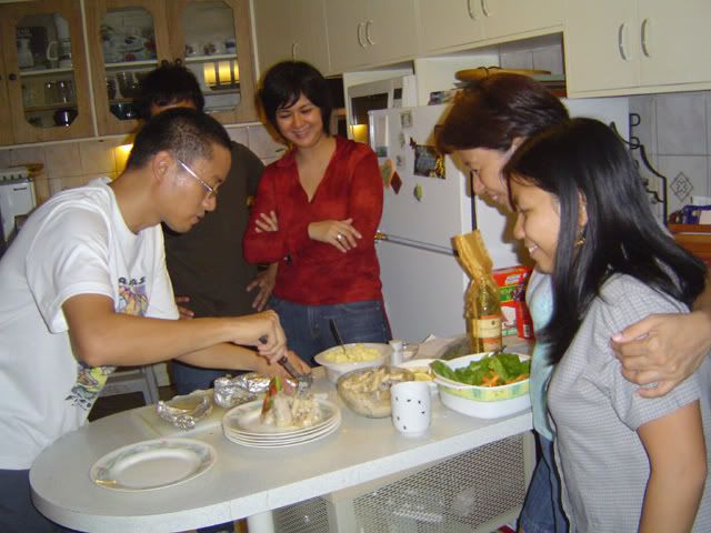 JB plating while the family looks hungrily on