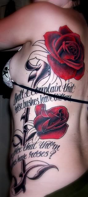 Rose tattoo on side with text